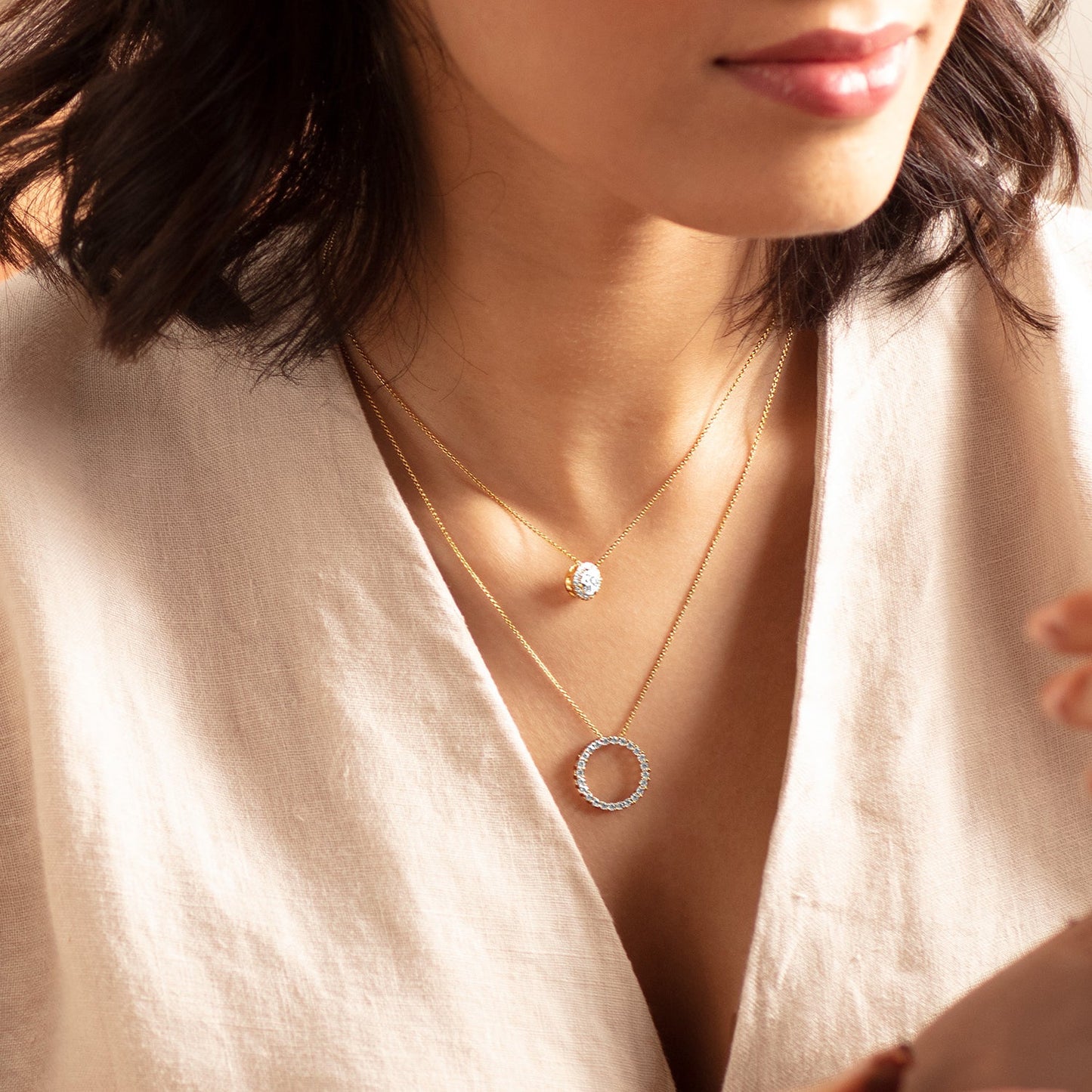 Circular Silhouette Atmos Necklace_Product Angle_Lifestyle Image