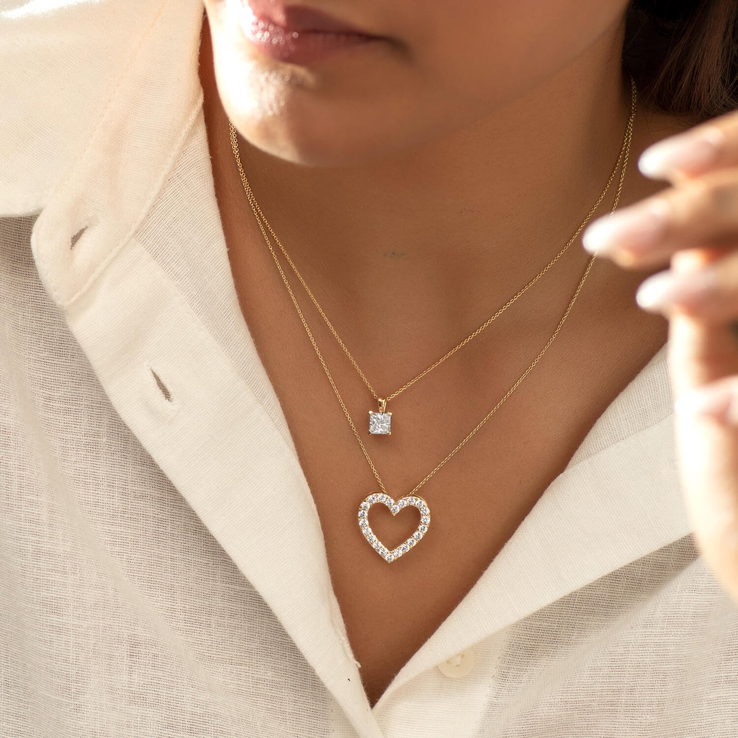 Atmos Heart Silhouette Necklace_Product Angle_Lifestyle Image
