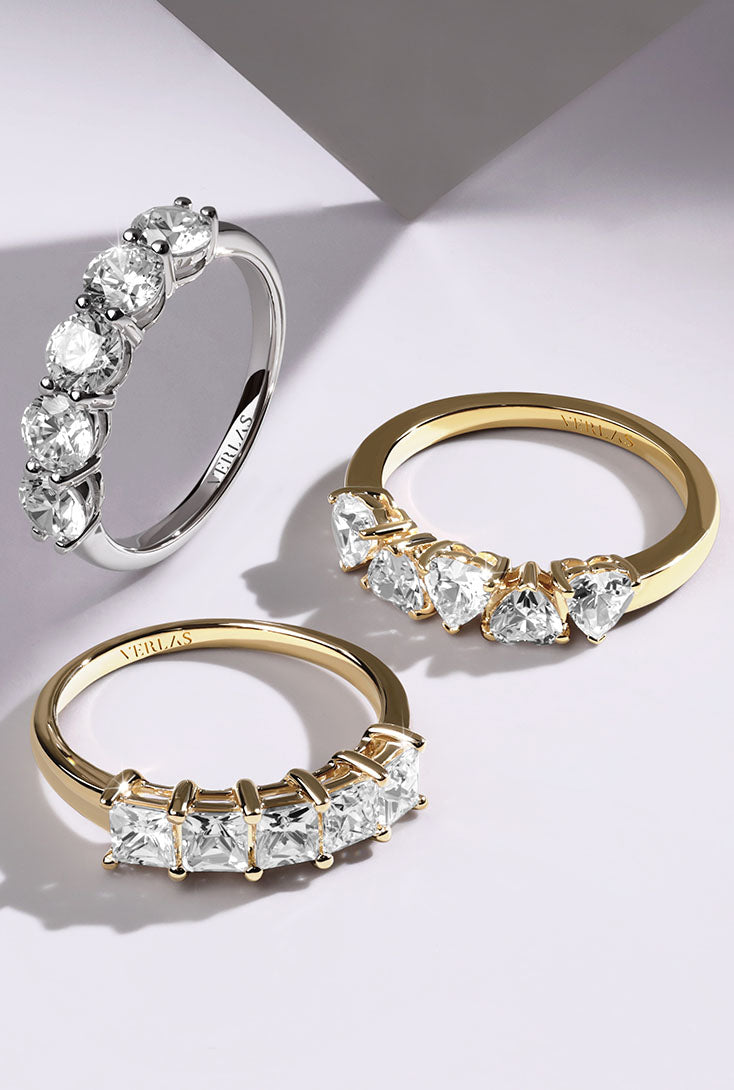 Thanksgiving_BFCM_Gifts_Experience_diamond_galore_with_our_3_and_5_Stone_Collection._Whether_you_are_celebrating_a_memorable_milestone_or_the_beauty_of_today,_these_meticulously_crafted_diamond_rings_are_sure_to_spark_adoration_Verlas_3_Stone_5_Stone_Ring